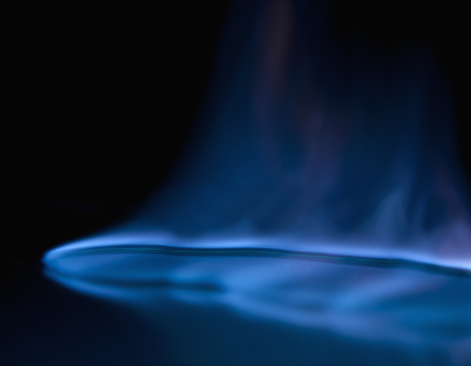 A close-up of a blue gas flame